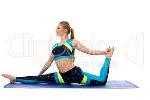 Beautiful slim girl doing stretching exercises