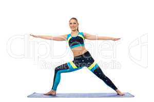 Pretty girl engaged in aerobics on mat