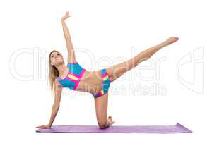 Beautiful athletic woman doing pilates exercise