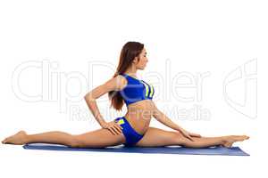 Pretty young woman doing gymnastic splits