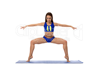 Studio shot of beautiful girl engaged in pilates