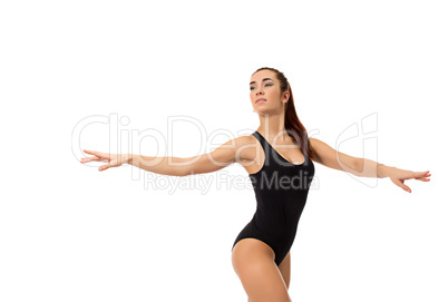 Dreamy female dancer posing at camera