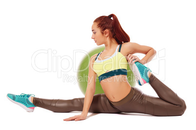 Side view of flexible girl exercising aerobics