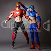 Men in costumes of Iron man and Captain America