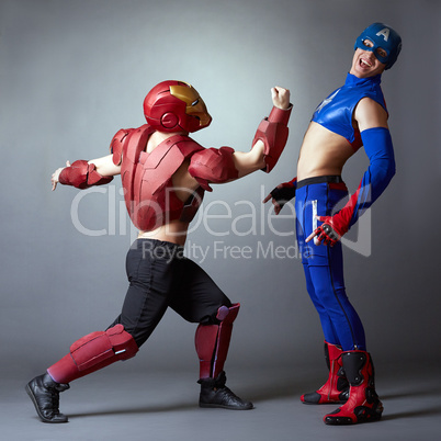Confrontation of superheroes. Sexy male dancers