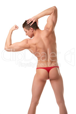 Rear view of half-naked bodybuilder shows biceps