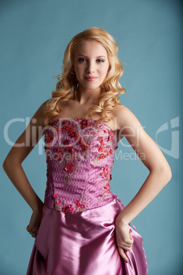 Attractive girl in elegant pink dress