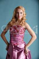 Attractive girl in elegant pink dress