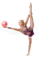 Pretty blonde gymnast dancing with ball