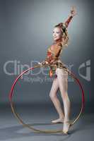 Free callisthenics. Cute young gymnast with hoop