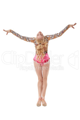 Rear view of graceful young gymnast posing