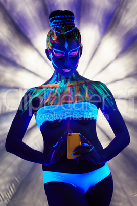 Amazing go-go dancer makes selfie under neon light