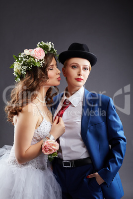Lesbian married couple posing in studio
