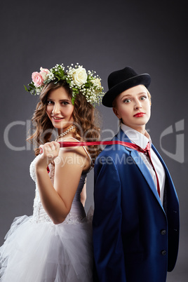 Beautiful lesbian couple in wedding outfits