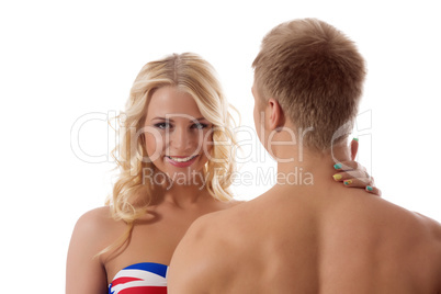 Smiling blonde touching her boyfriend's neck