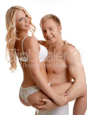 Image of happy young lovers embracing at camera