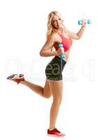 Happy young blond woman engaged in fitness
