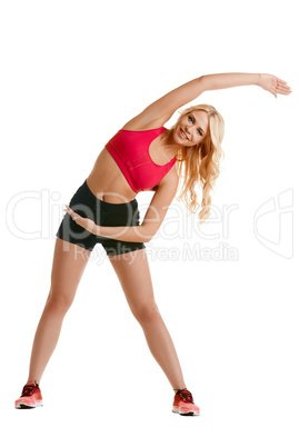 Beautiful young woman doing warm-up exercise