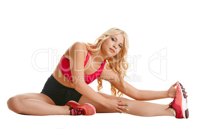 Shot of athletic blonde doing stretching exercise