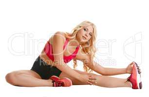 Shot of athletic blonde doing stretching exercise