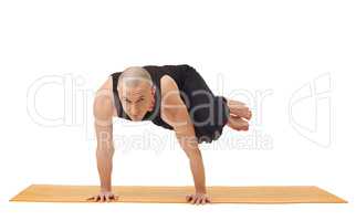 Yoga instructor looking at camera while exercising