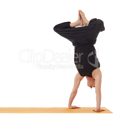 Yoga lessons. Image of instructor doing handstand