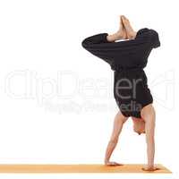 Yoga lessons. Image of instructor doing handstand