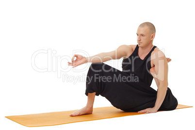 Yoga training. Studio photo of man exercising