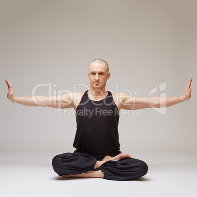 Attractive yoga guru posing while exercising