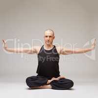 Attractive yoga guru posing while exercising