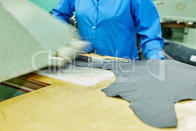 Image of cutting leather using semiautomatic press