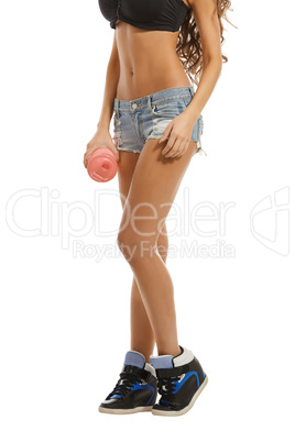 Close-up of leggy athletic girl with shaker