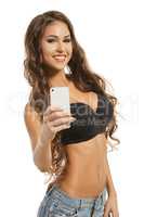 Image of happy beddable model doing selfie
