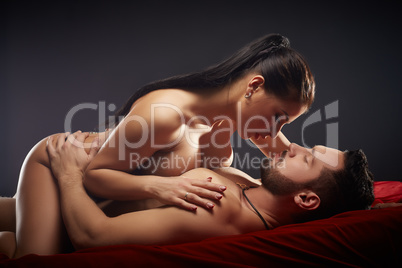 Studio shot of passionate couple having sex