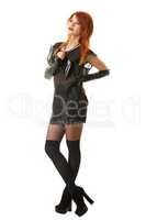 Charming red-haired model posing in gothic clothes