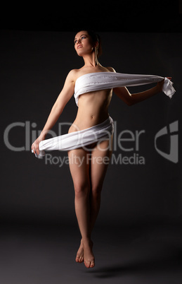 Image of seductive female dancer soaring in air