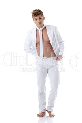 Studio shot of hunk in elegant white suit