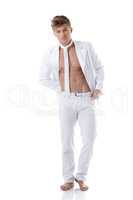 Studio shot of hunk in elegant white suit