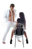 Striptease. Handsome man dancing in front of girl