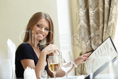 Sexy woman posing with menu at lunch time