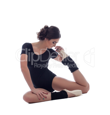 Ballet. Charming dancer doing stretching exercises