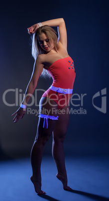 Image of sexy go-go dancer posing in UV light