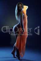 Sexy dancer posing nude under neon light