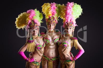 Image of pretty carnival dancers posing at camera