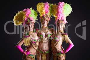 Image of pretty carnival dancers posing at camera