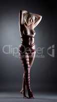 Kinbaku concept. Naked blonde tied with rope
