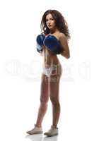 Half-naked model posing in boxing gloves