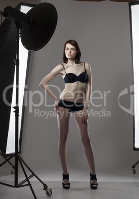 Image of leggy girl posing in studio photography