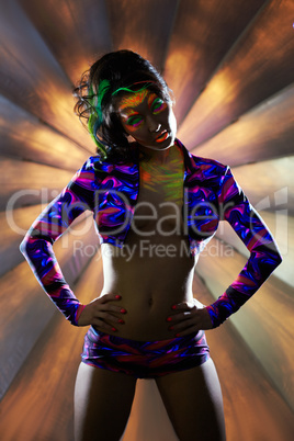 Image of sexy club dancer posing in neon light
