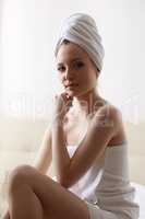 Beautiful woman dressed in towel after taking bath